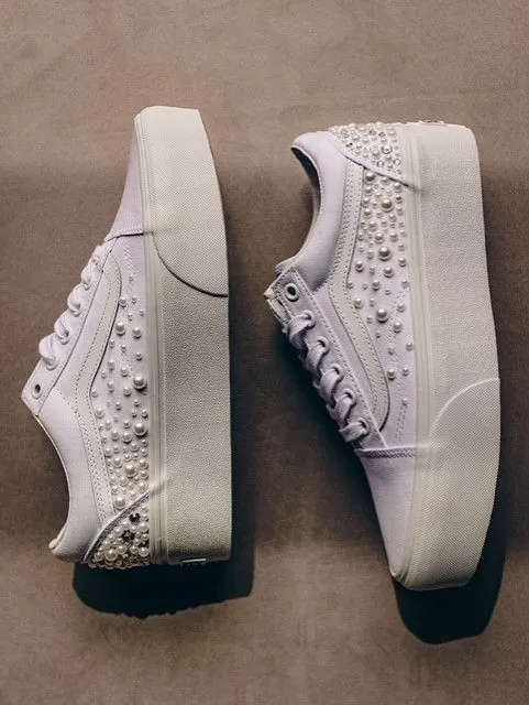 White platform sneakers studded with pearls and crystals
