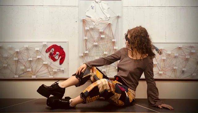 Patchwork pants styled on a gallery bench