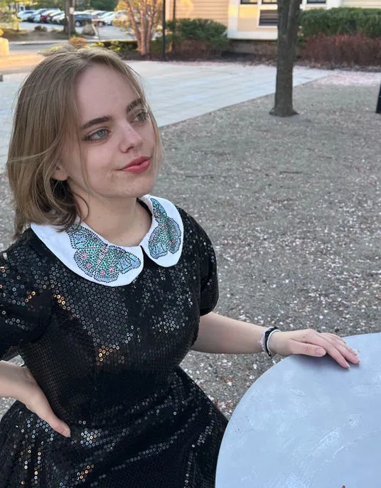Black sequin dress with a white beaded Peter Pan collar