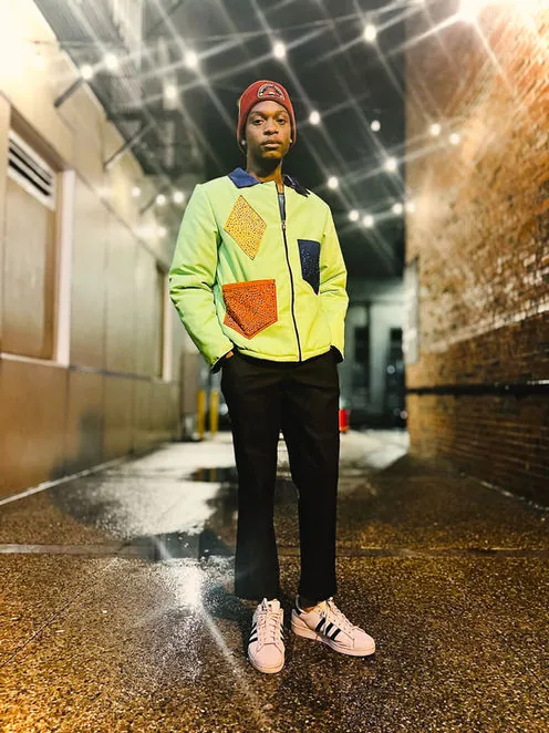 Model in a neon green quilted jacket with patch pockets
