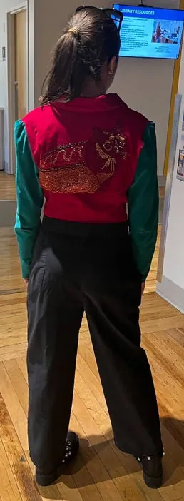 Red and green color-block jacket, back view