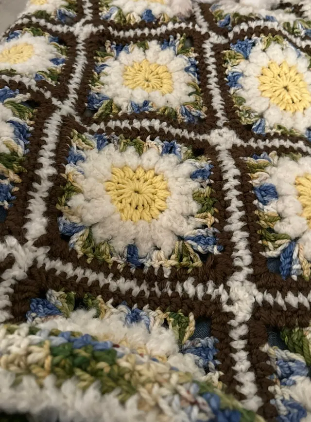 Close-up of daisy granny squares in yellow and white