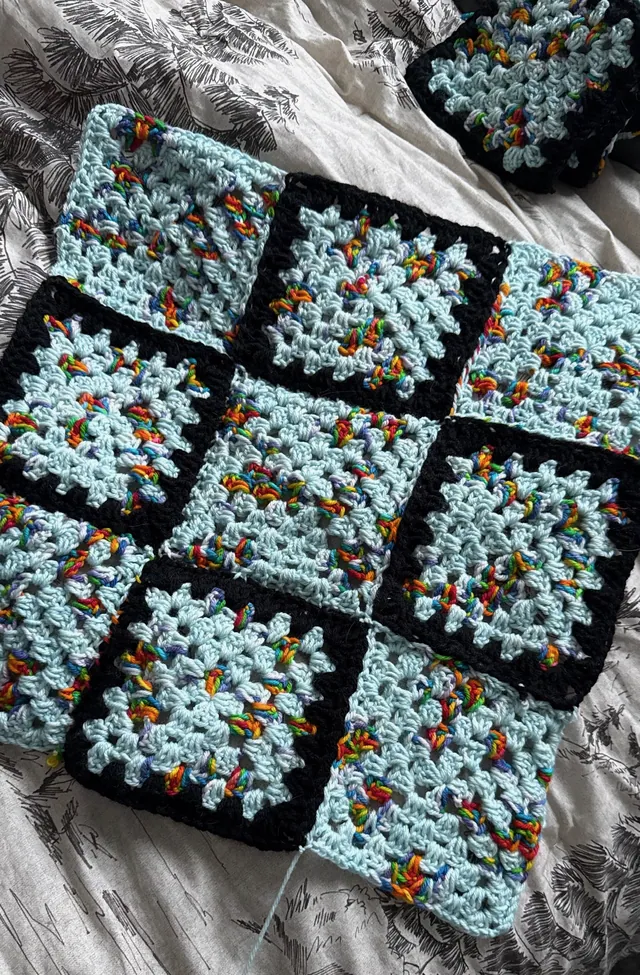 Light blue granny squares with black borders